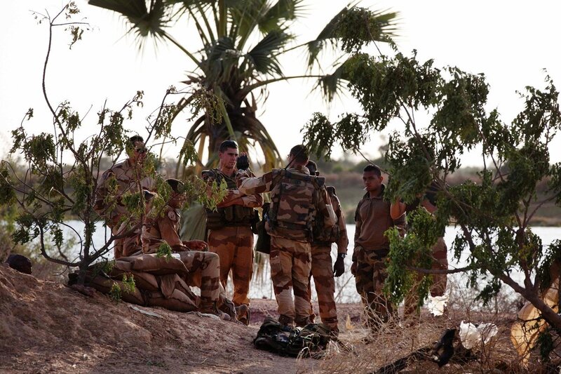 Soldiers on riverbank patrol
