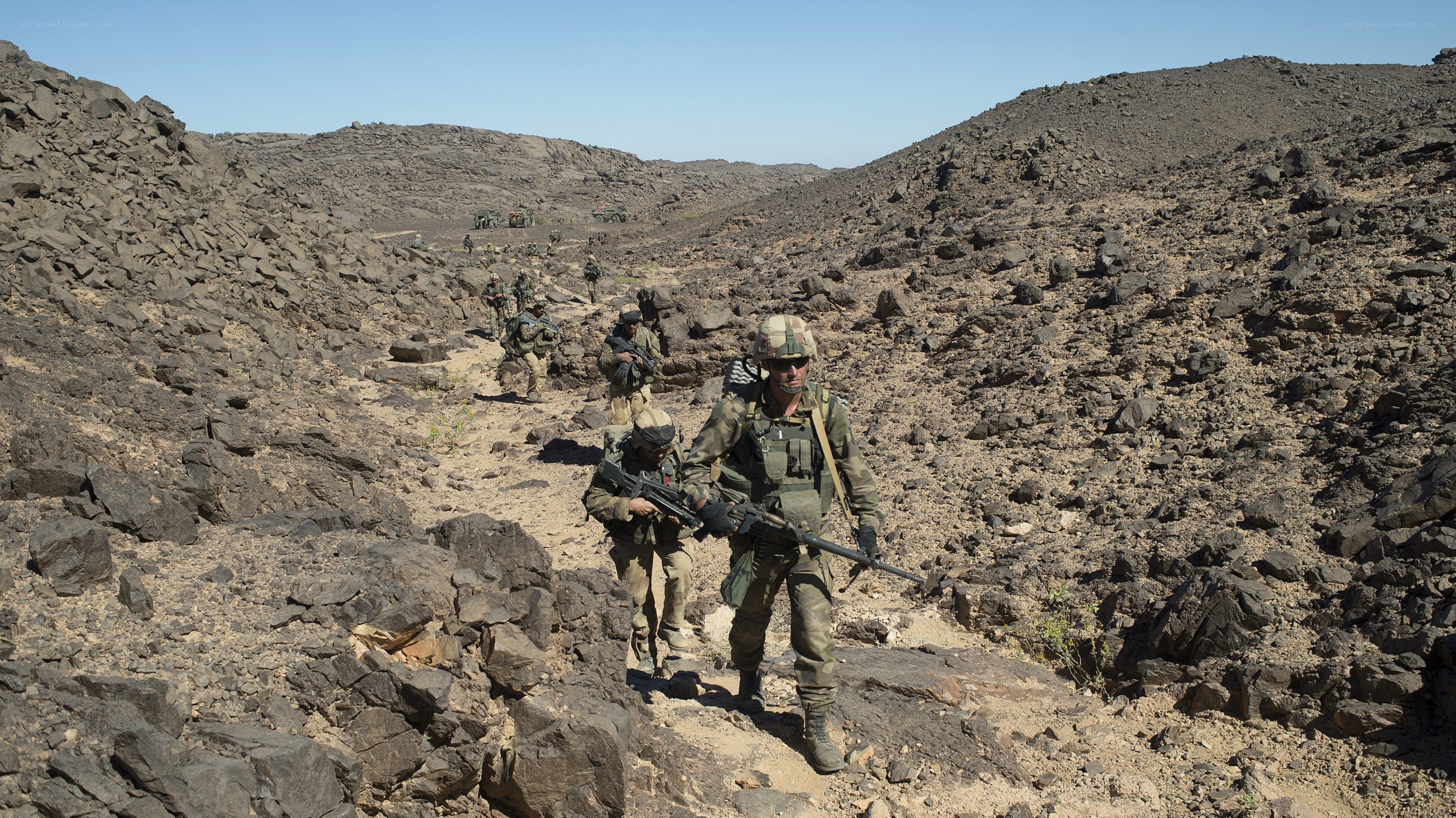 Soldiers on rocky terrain