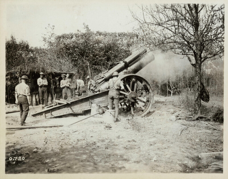 Soldiers operating artillery cannon