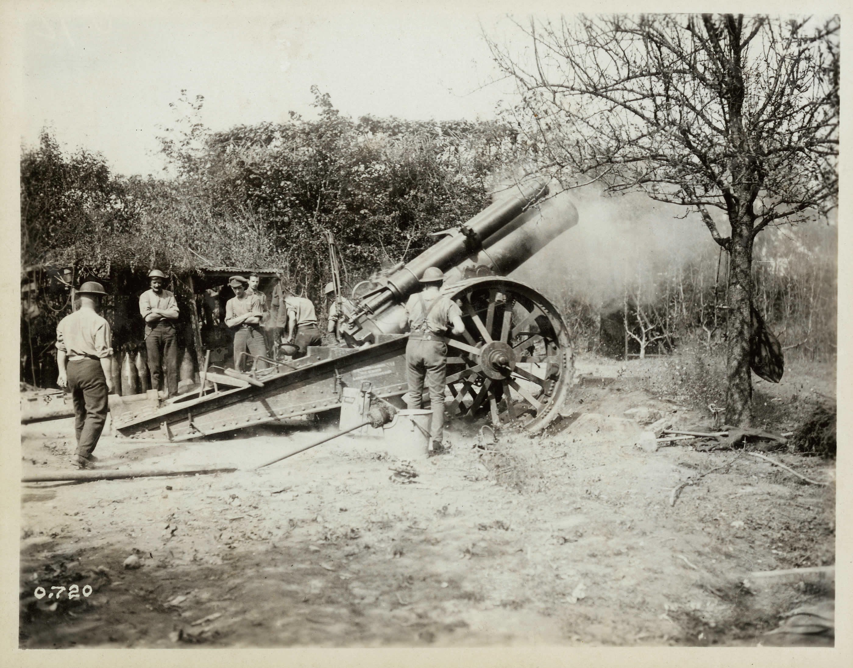 Soldiers operating artillery cannon