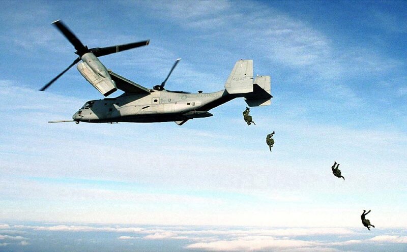 Soldiers Parachuting from Aircraft — Blue