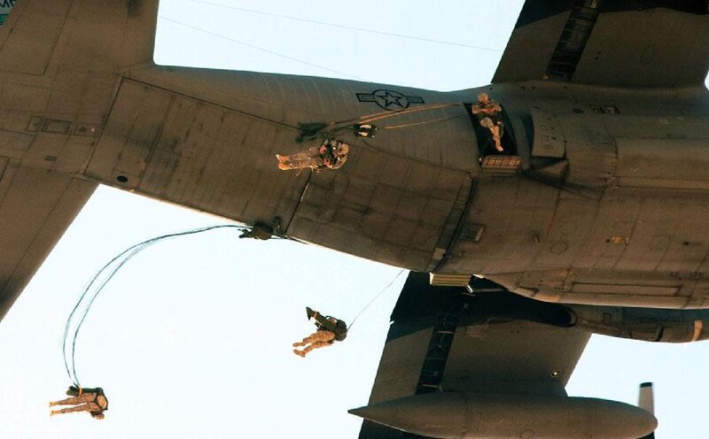 Soldiers Parachuting from Plane