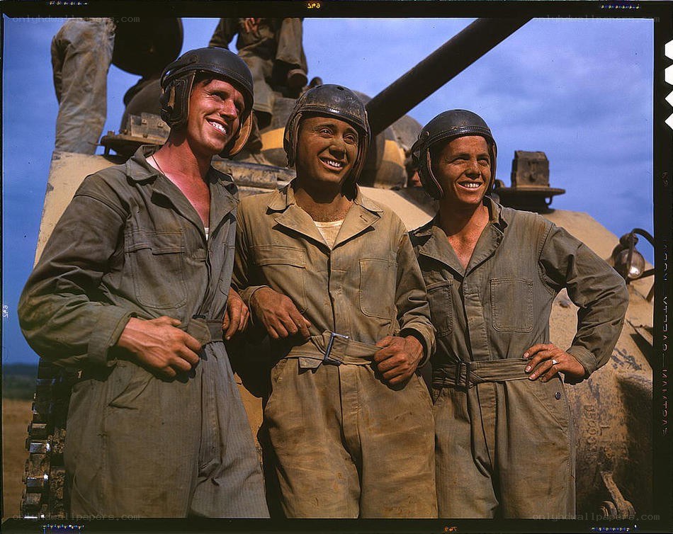 Soldiers posing by tank