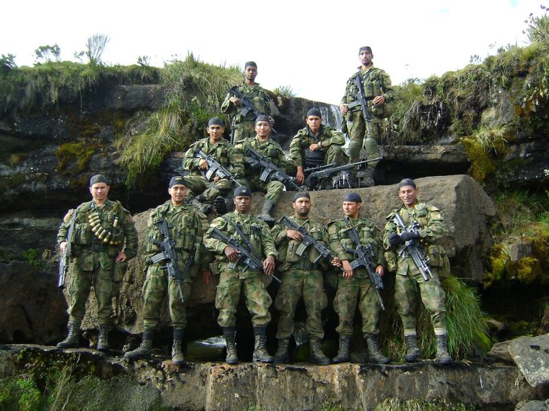 Soldiers posing with rifles