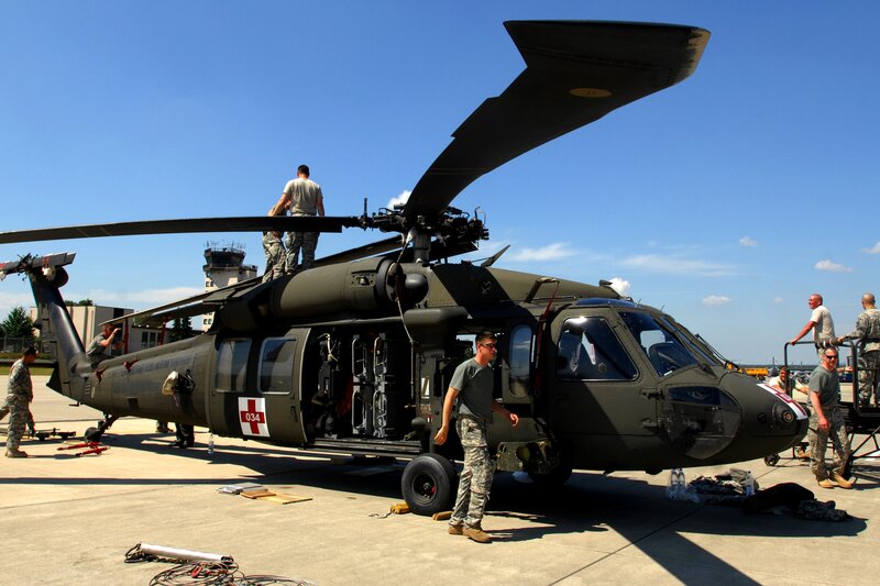 Soldiers preparing a military helicopter
