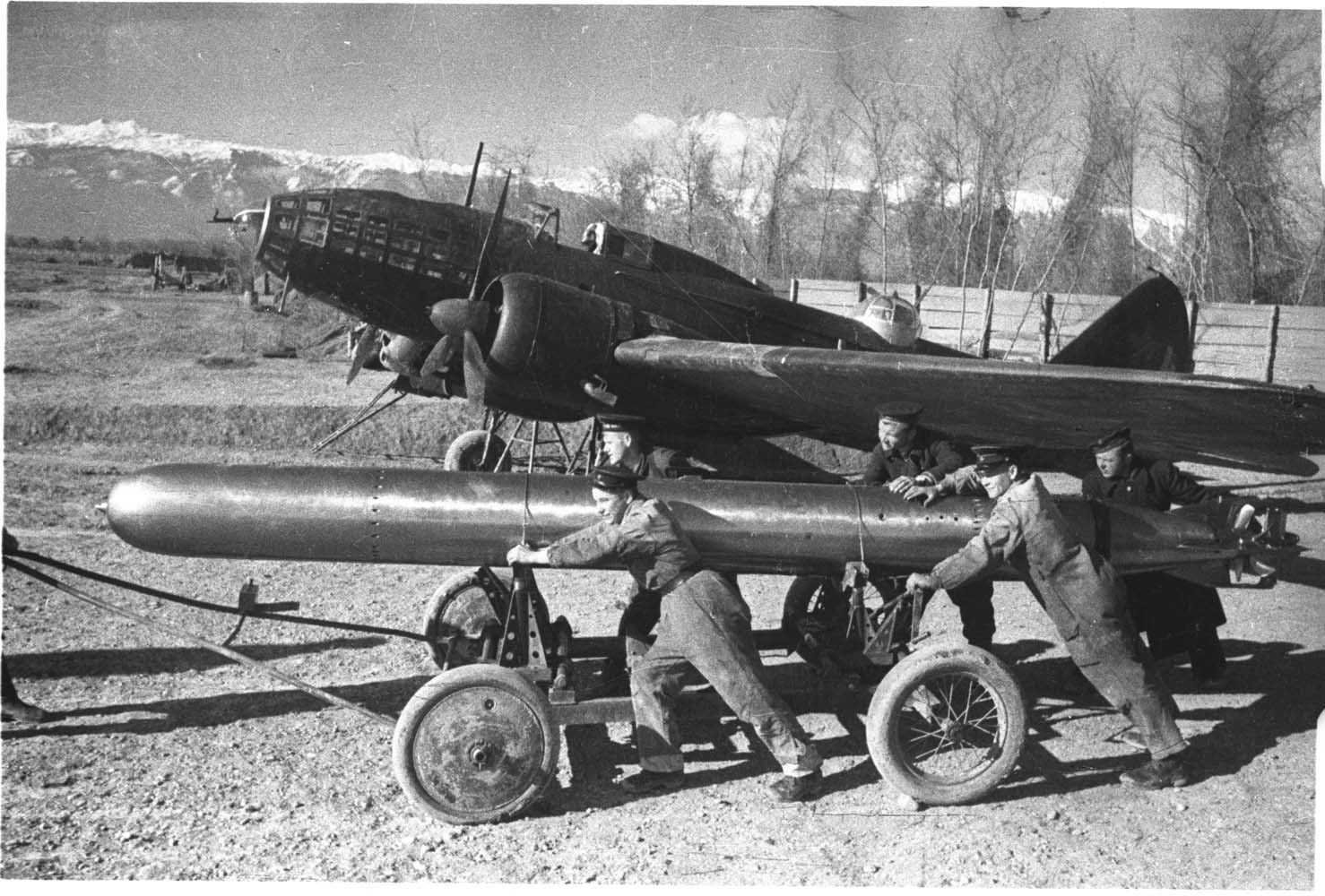 Soldiers preparing aircraft bomb