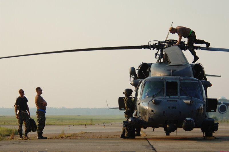 Soldiers preparing helicopter