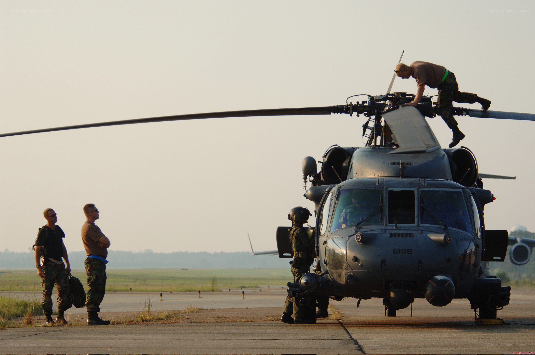 Soldiers preparing helicopter