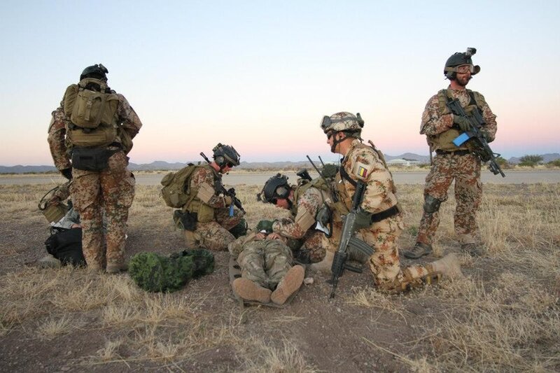 Soldiers providing medical aid