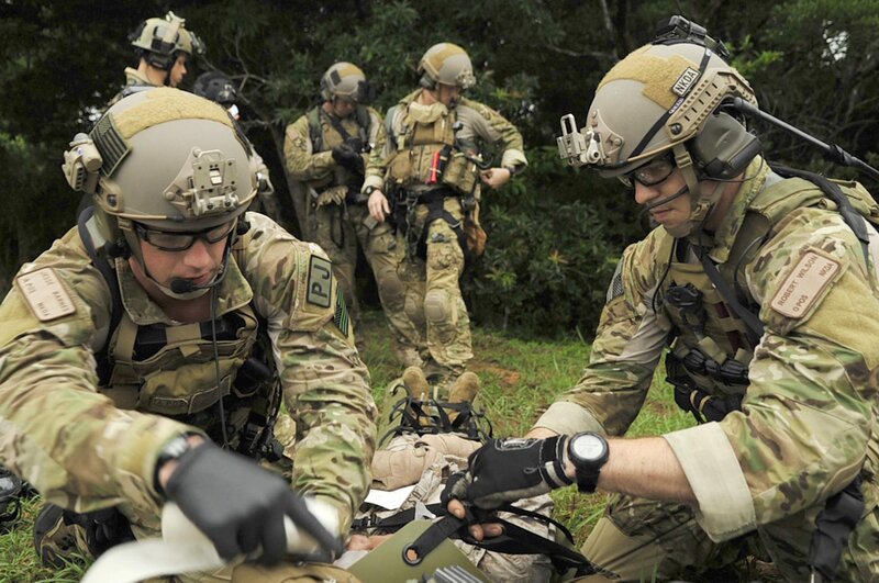Soldiers providing medical aid