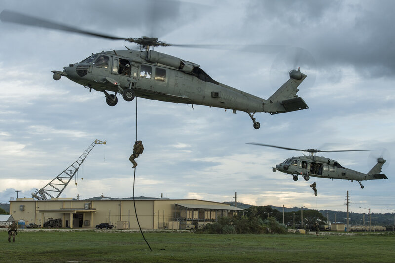 Soldiers Rappelling from Helicopters