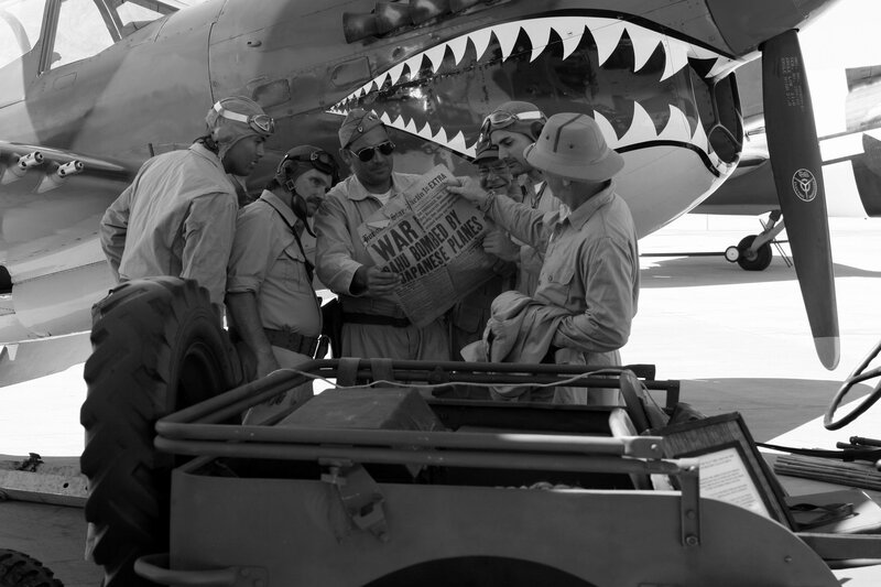 Soldiers reading war news by plane