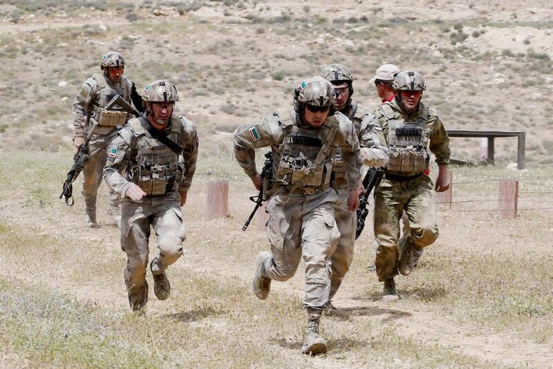 Soldiers Running in Field