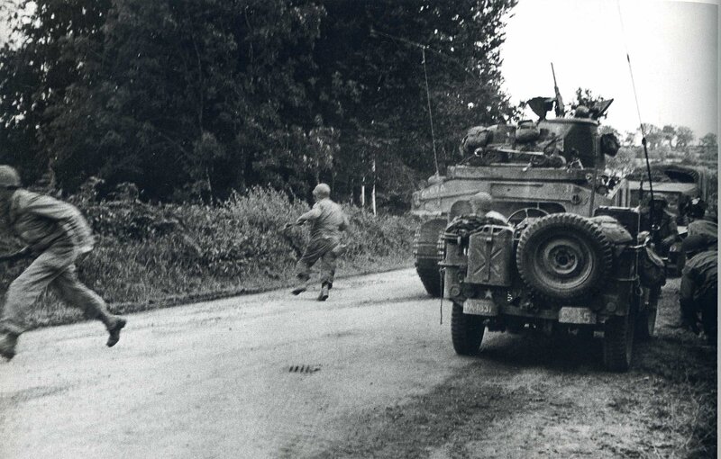 Soldiers running near military vehicles