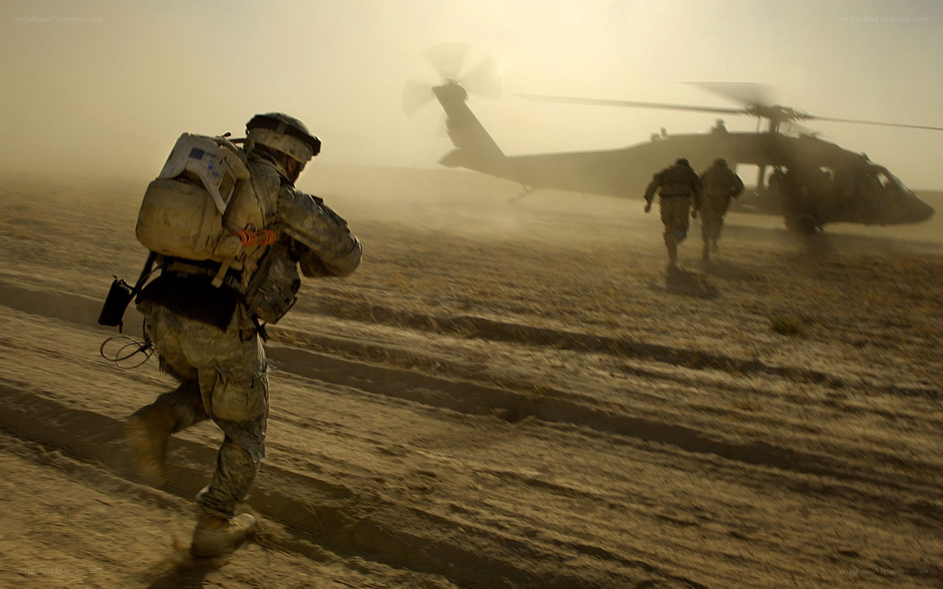 Soldiers running to helicopter