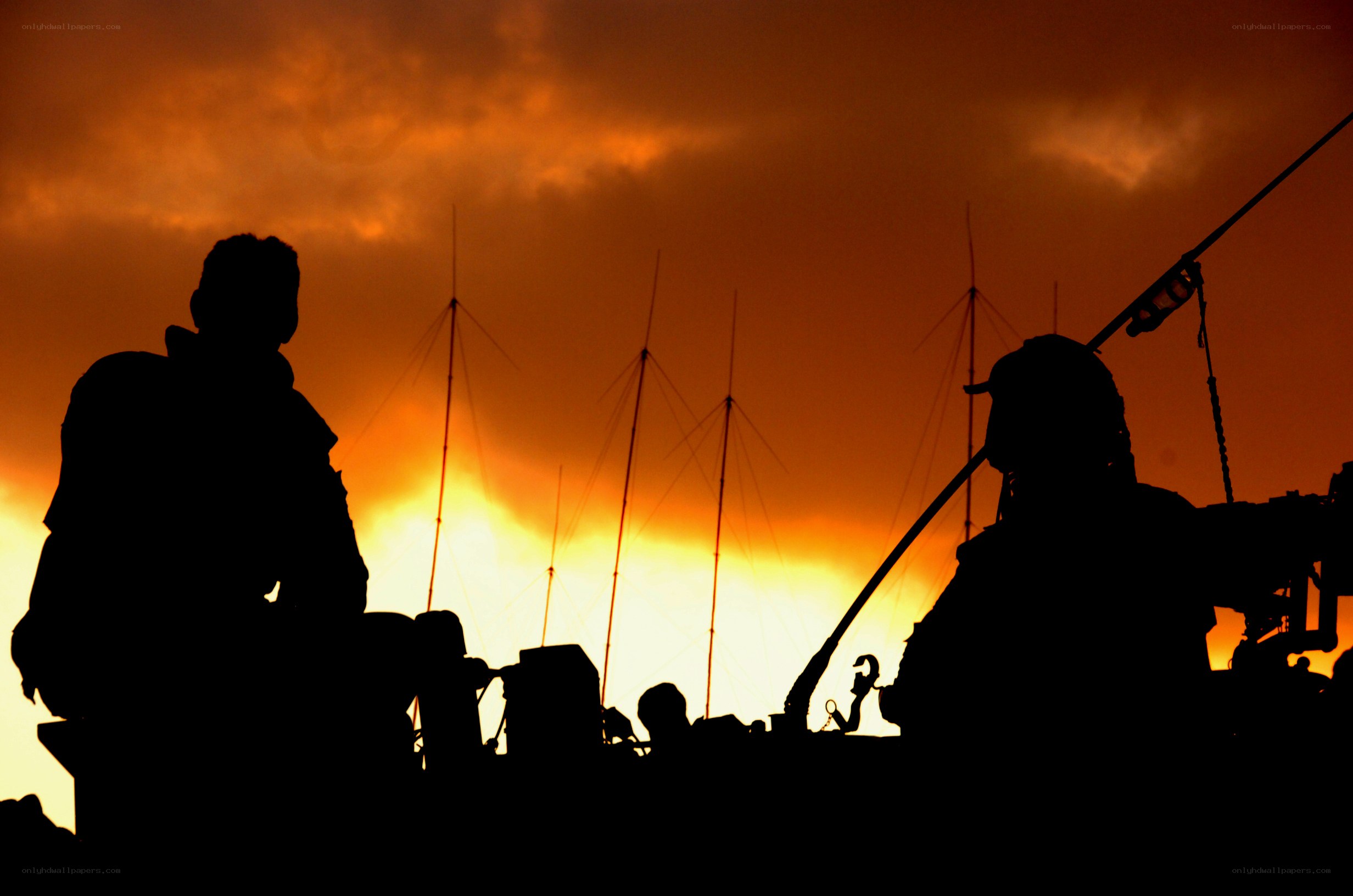 Soldiers silhouetted at sunset