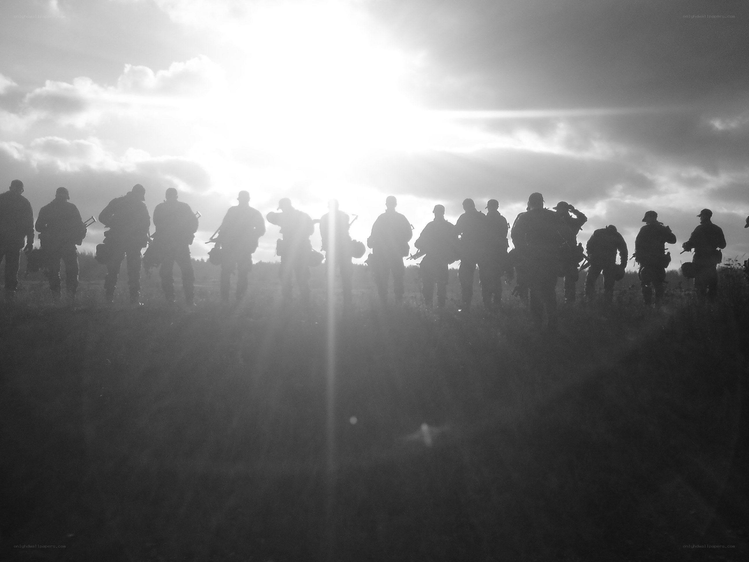 Soldiers silhouetted at sunset