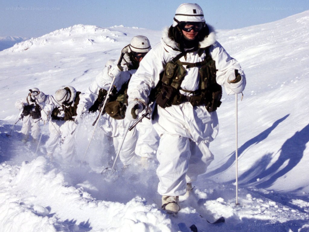Soldiers skiing in snow