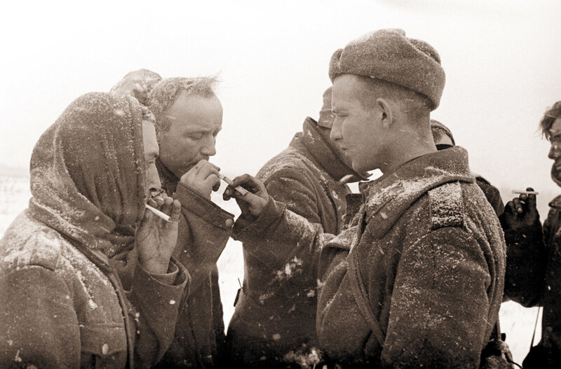 Soldiers smoking in snow