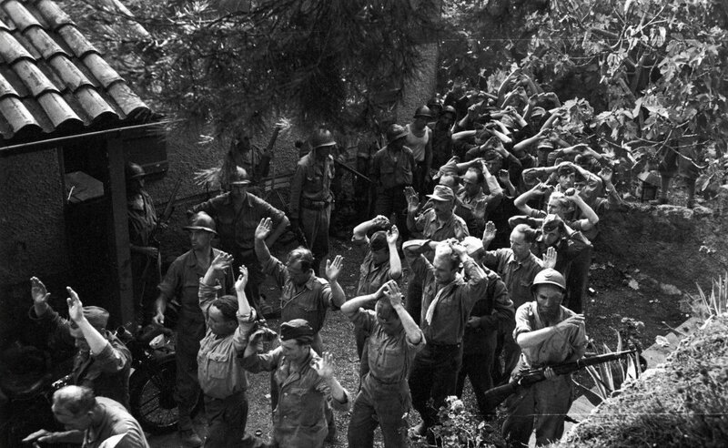 Soldiers surrendering in forest