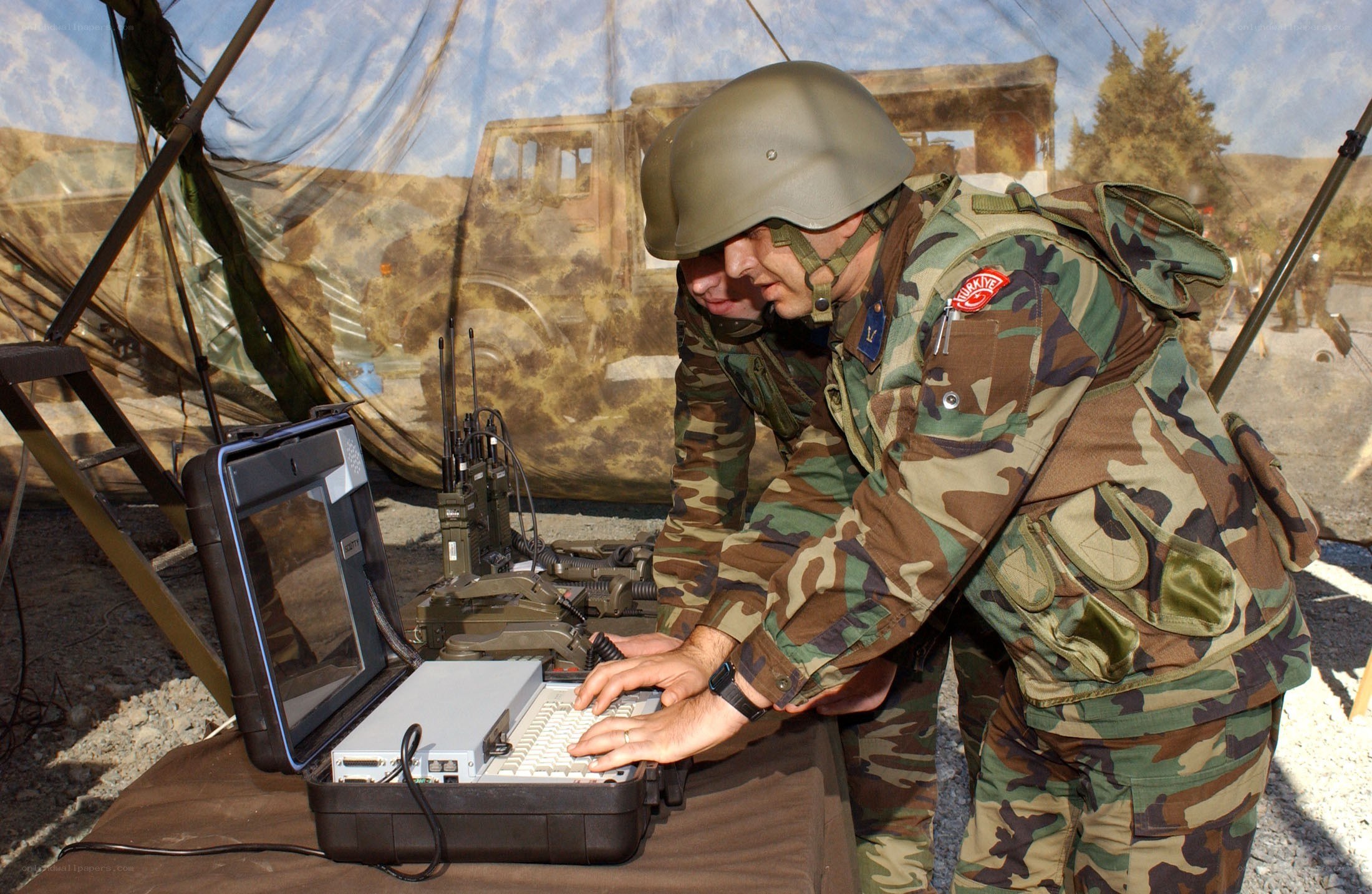 Soldiers using communication equipment