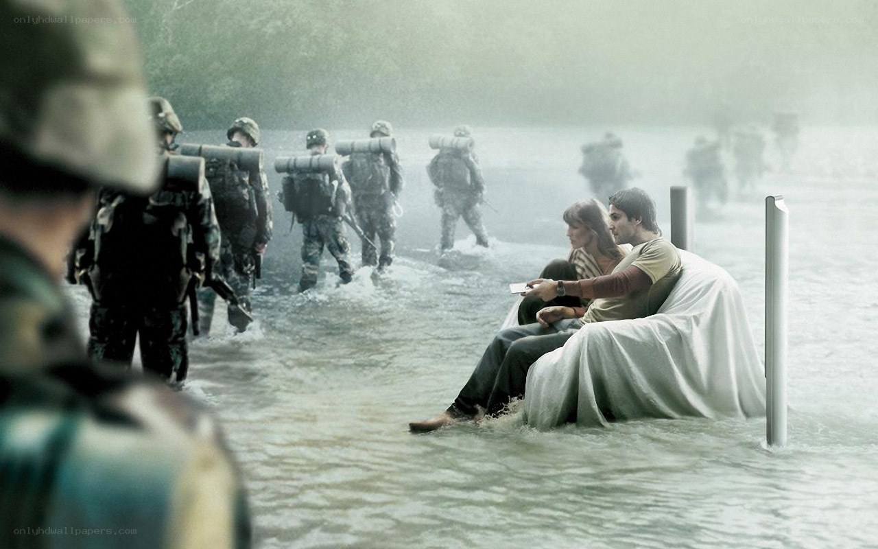 Soldiers wade through floodwaters