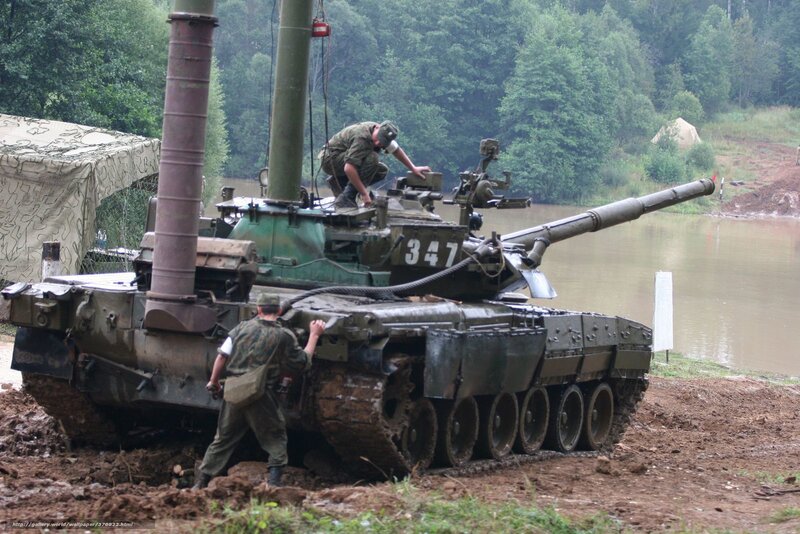 Soldiers with a tank in muddy terrain