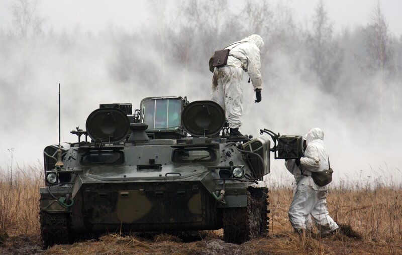 Soldiers with armored vehicle