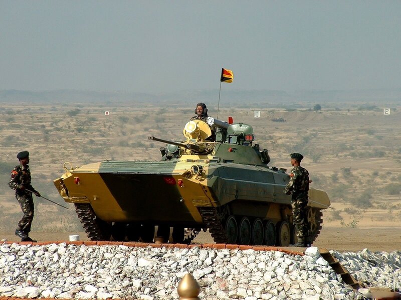 Soldiers with armored vehicle