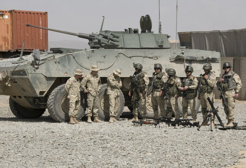 Soldiers with armored vehicle