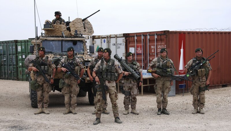 Soldiers with armored vehicle