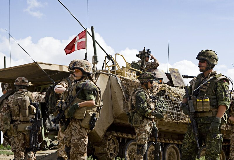 Soldiers with armored vehicle