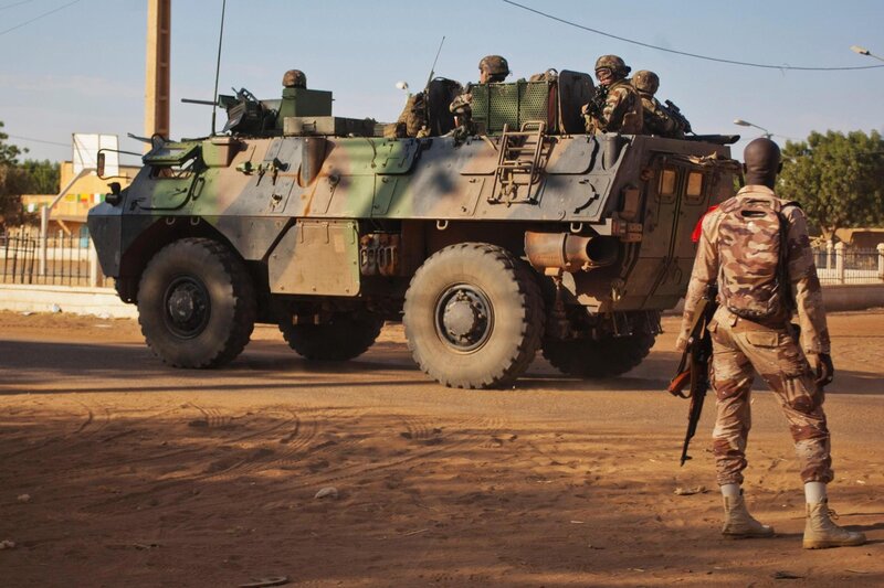 Soldiers with armored vehicle