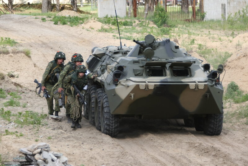 Soldiers with armored vehicle