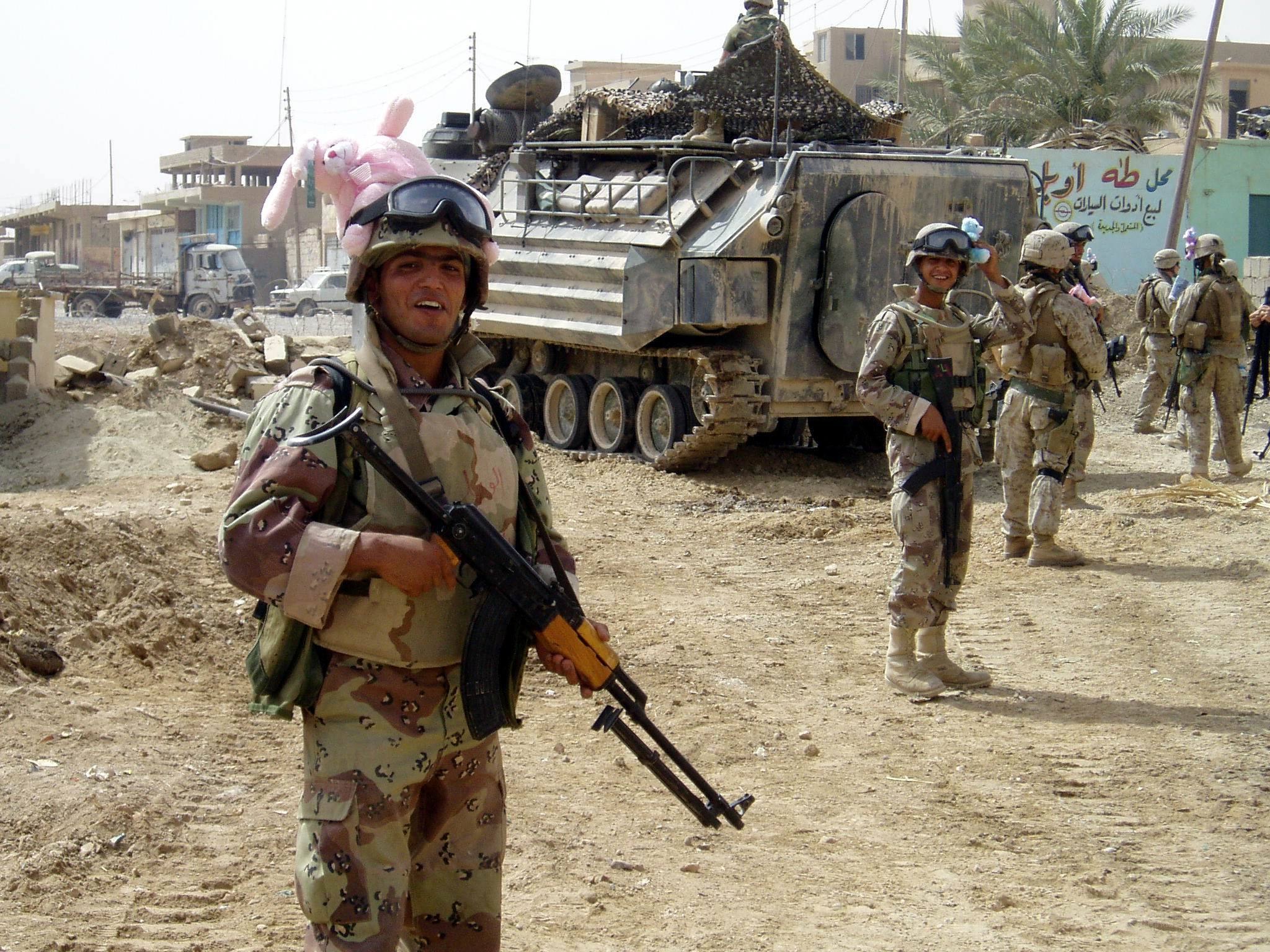 Soldiers with armored vehicle