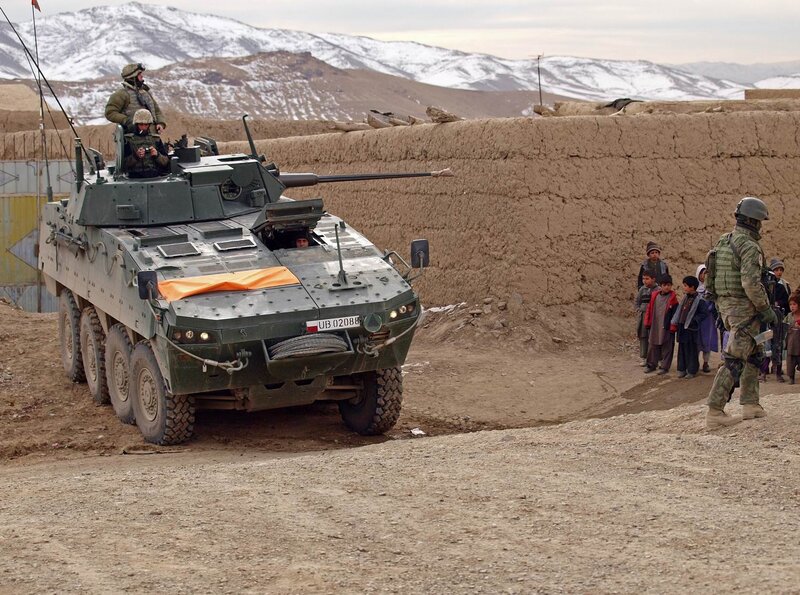 Soldiers with armored vehicle in Afghanistan