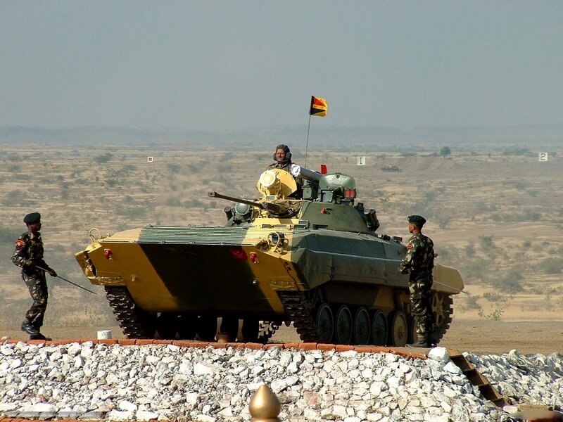 Soldiers with armored vehicle