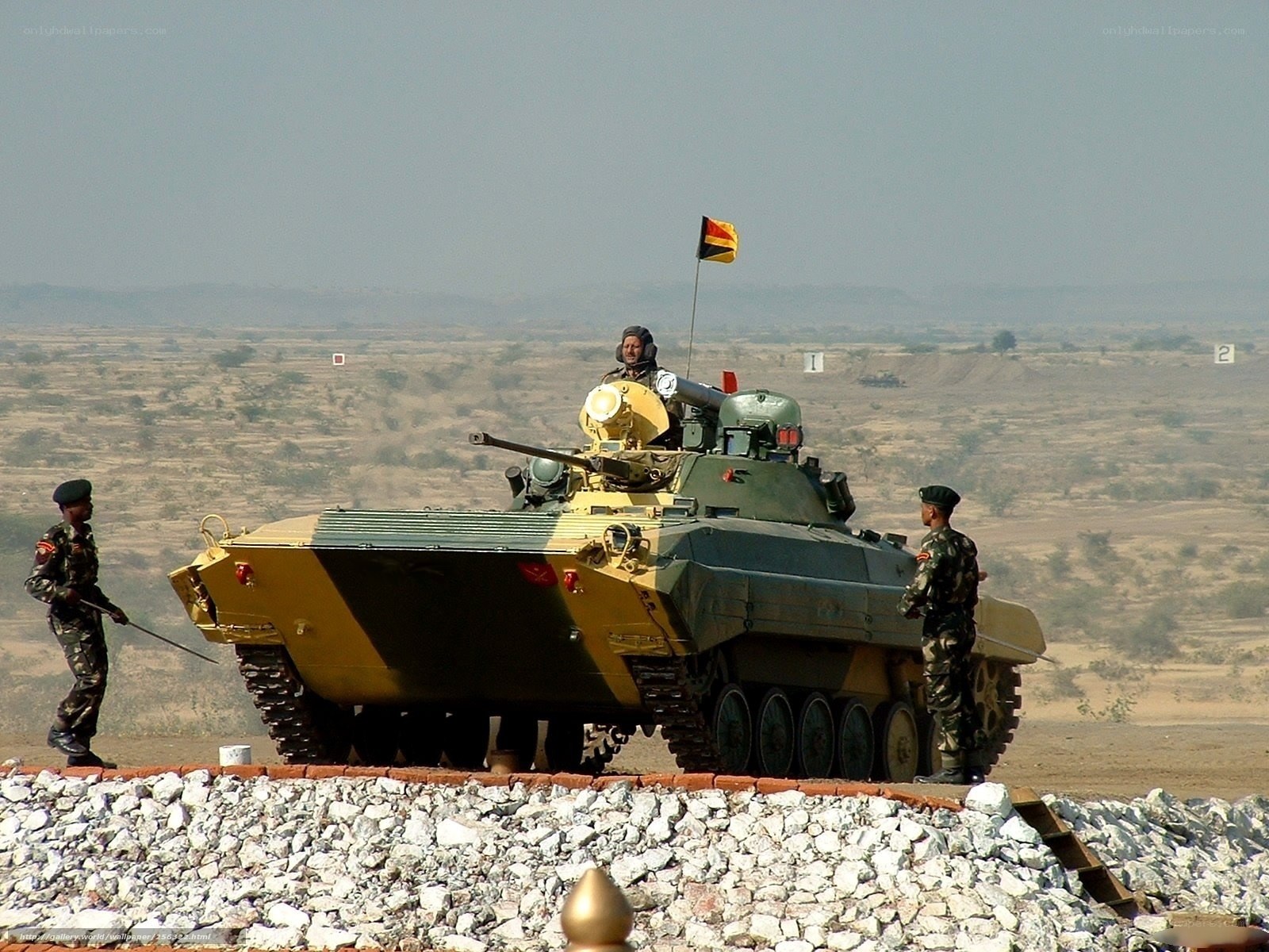Soldiers with armored vehicle