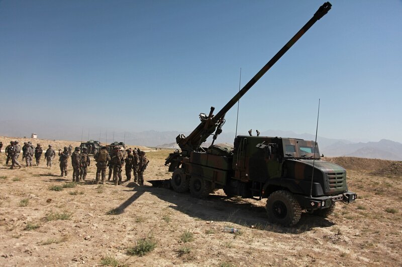 Soldiers with artillery in desert