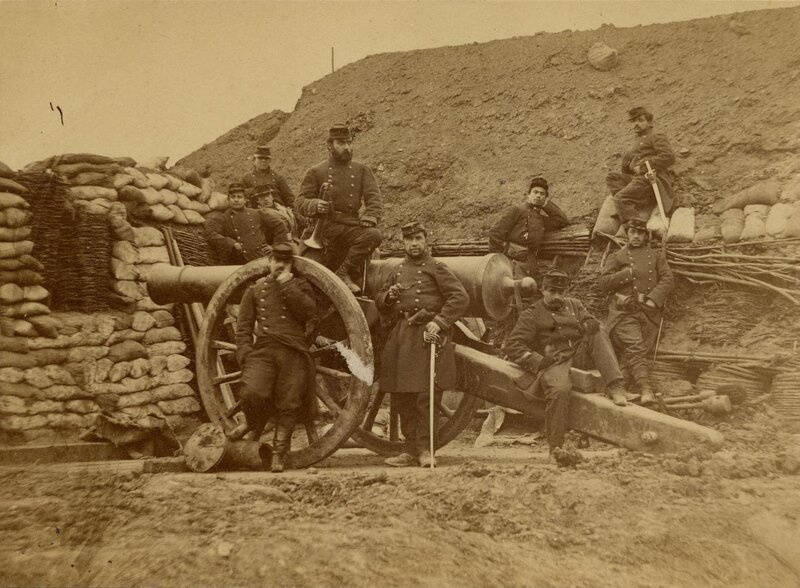 Soldiers with cannon in trench