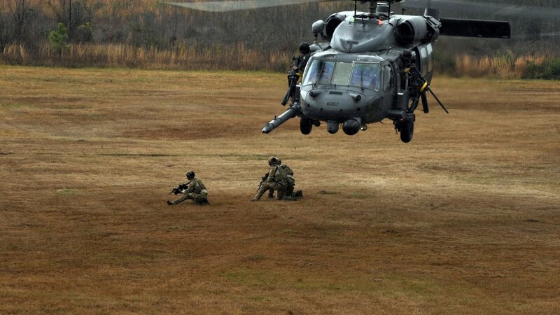Soldiers with Helicopter — Brown, Tense, Autumn, Photograph