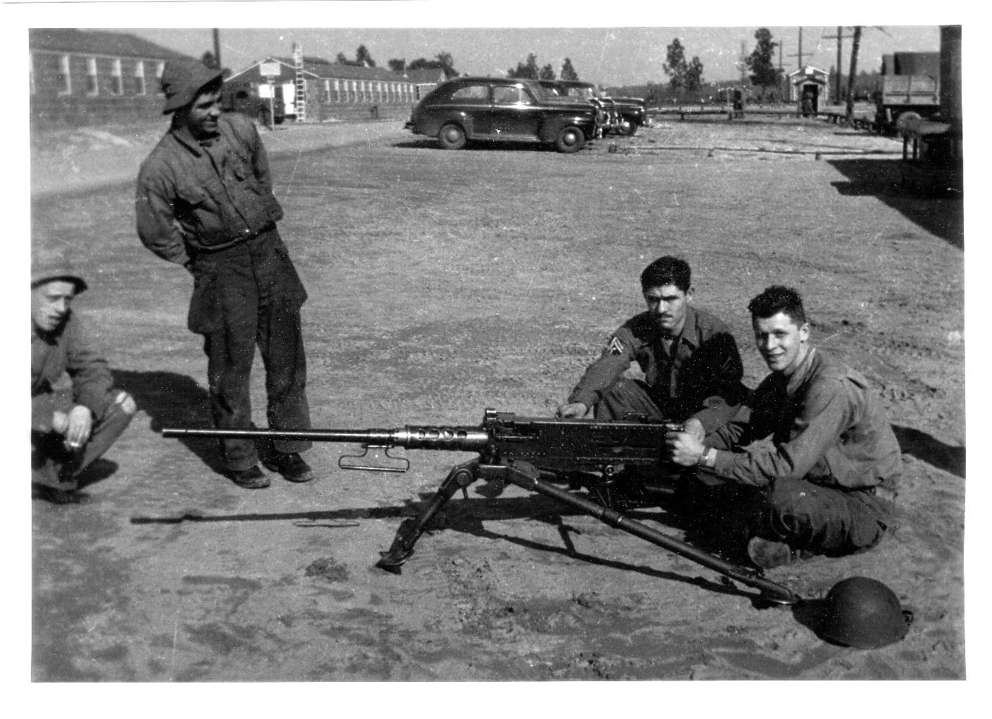 Soldiers with machine gun at base