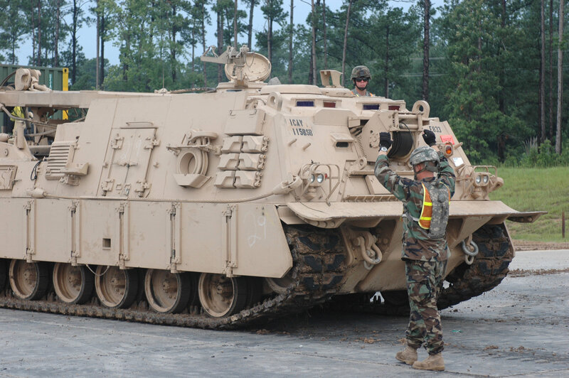 Soldiers with military vehicle