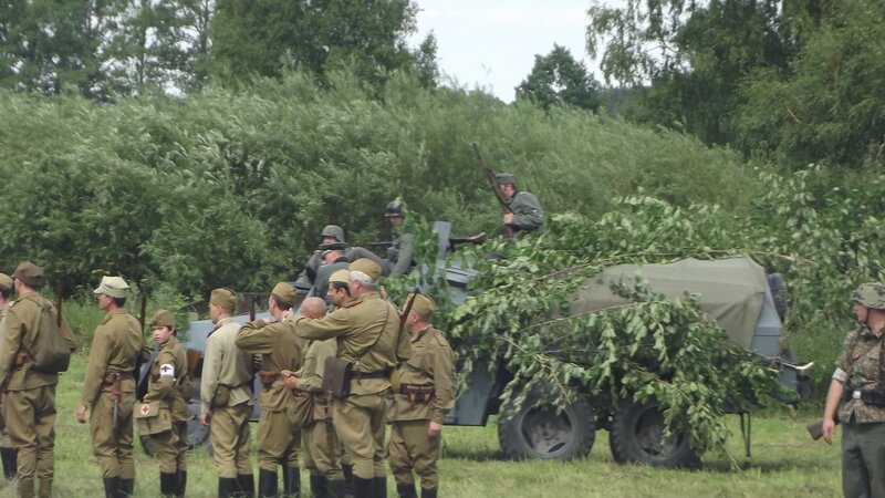Soldiers with military vehicle