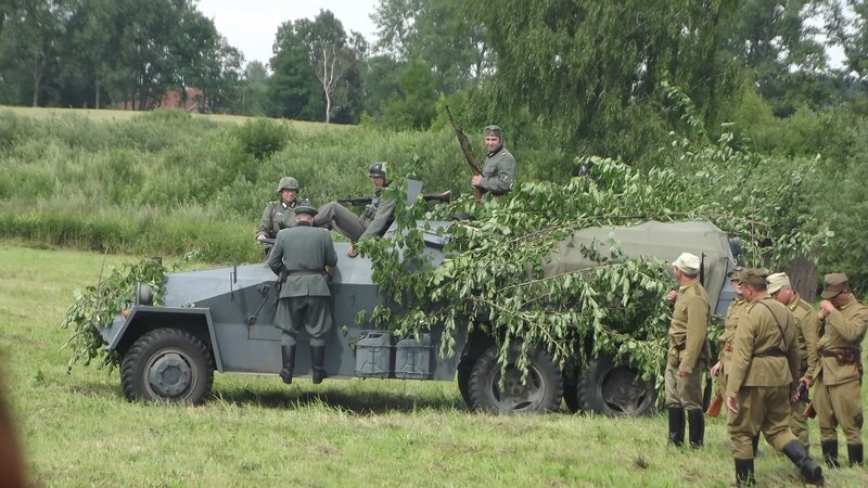 Soldiers with military vehicle
