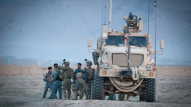 Soldiers with military vehicle