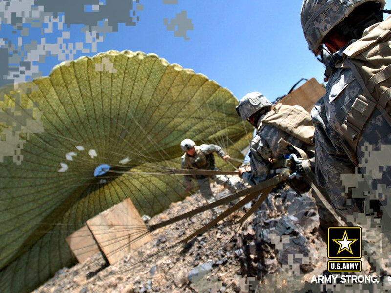 Soldiers with parachute on rocky terrain