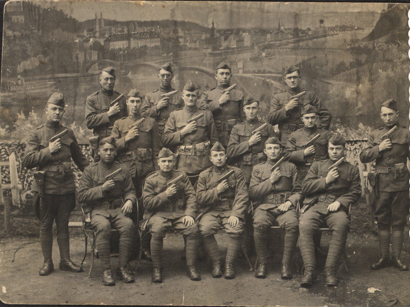 Soldiers with pistols in studio