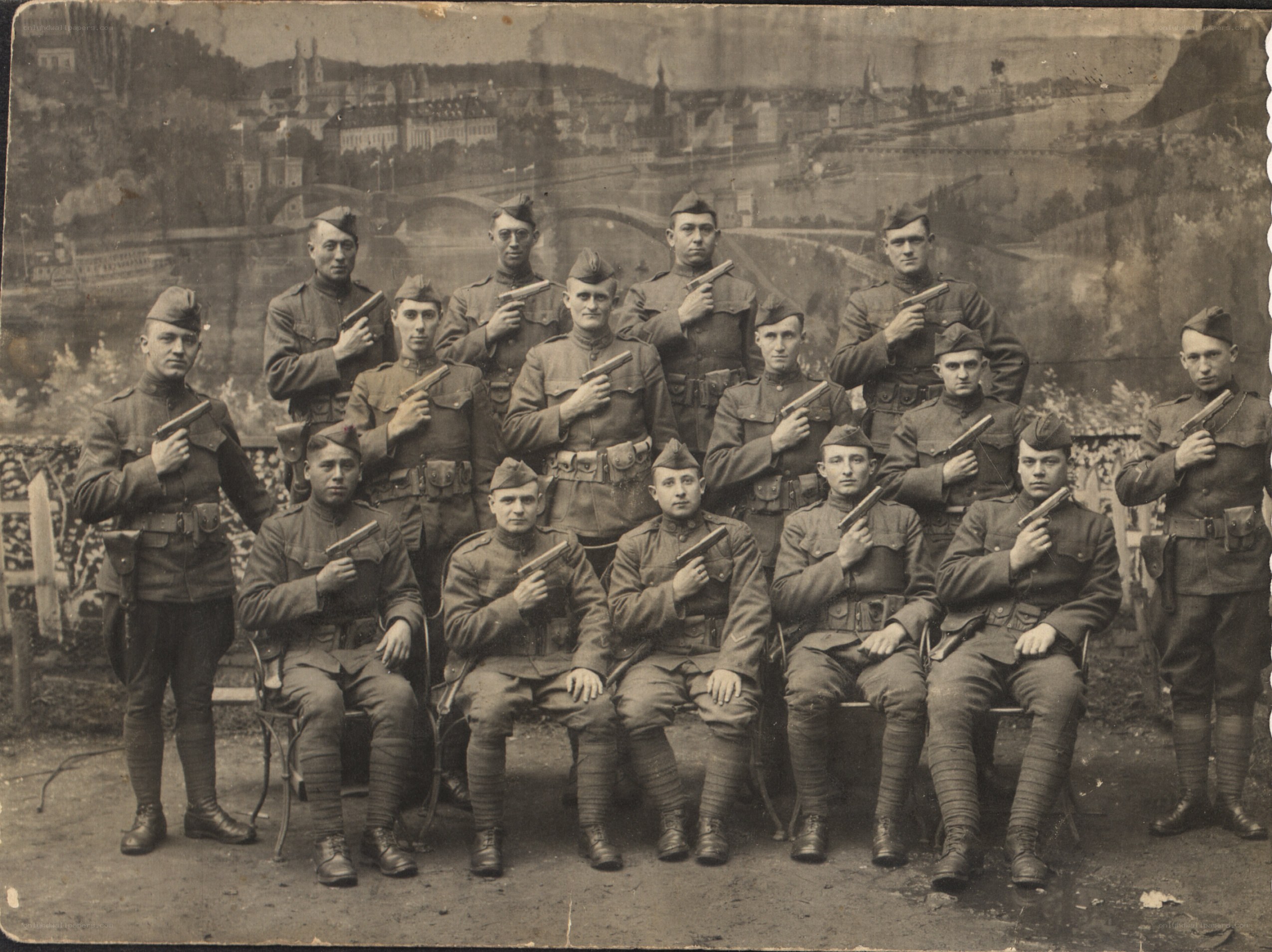 Soldiers with pistols in studio