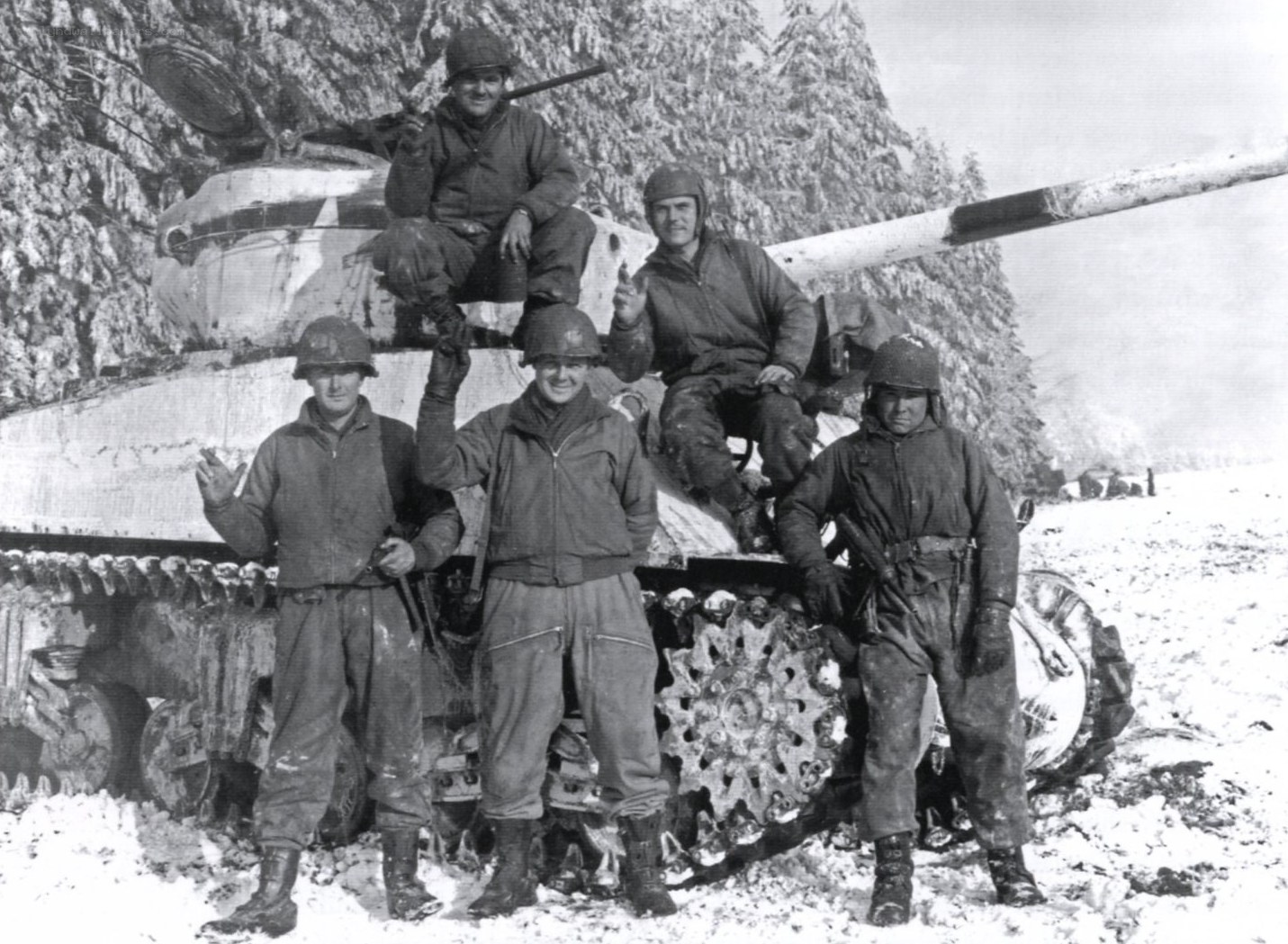 Soldiers with tank in snow